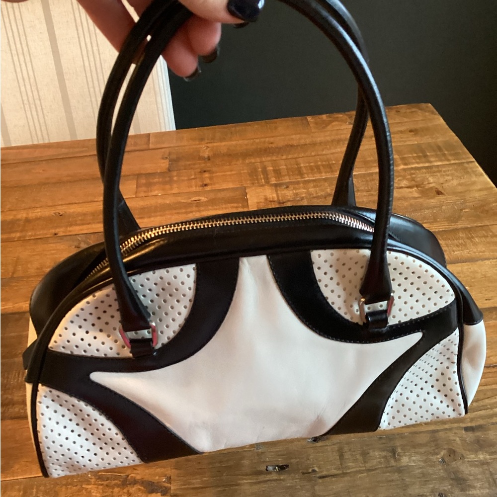 Authentic, black and white Prada Vitello Drive leather bowler bag.